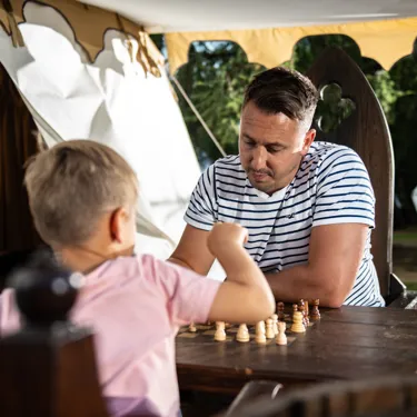 Father and son playing chess