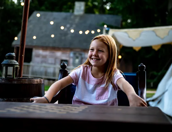 Girl on seat at Glamping